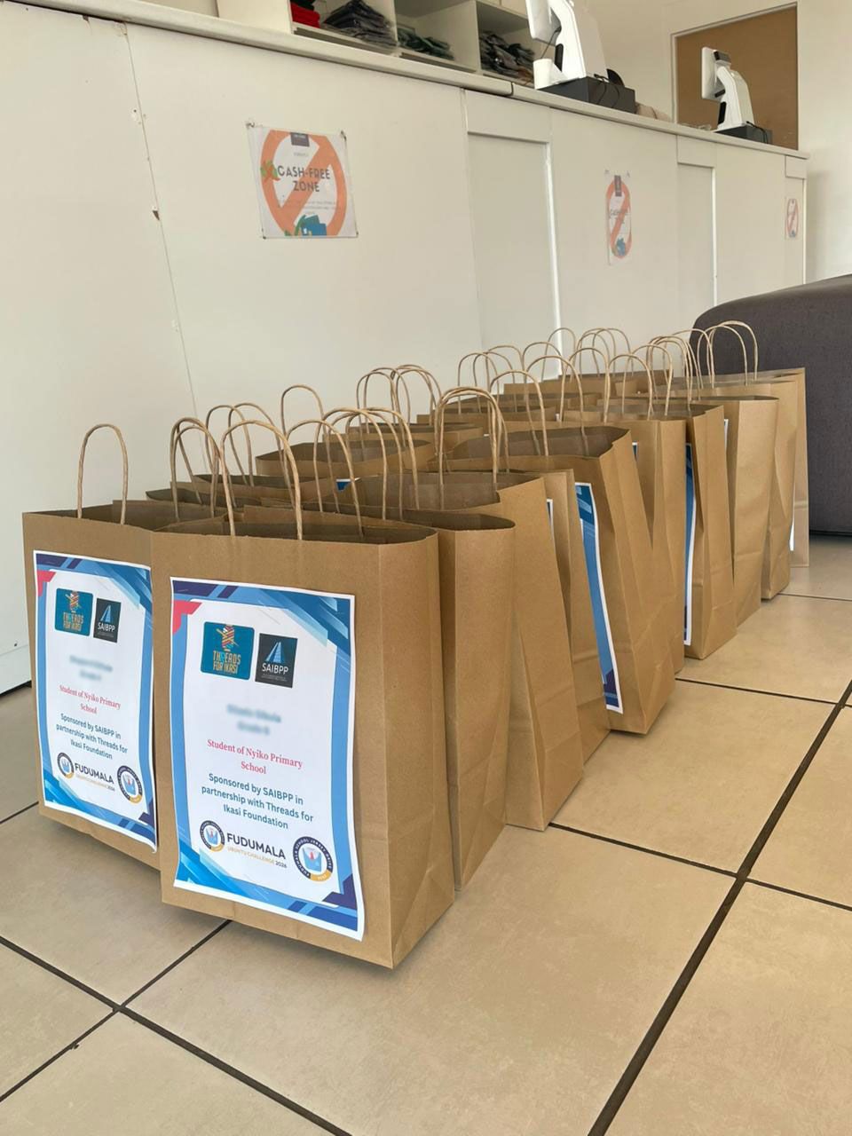 All Fudumala Packs lined up and ready, prepared by Threads for Ikasi Foundation and SAIBPP Women's Forum for Nyiko Primary School learners
