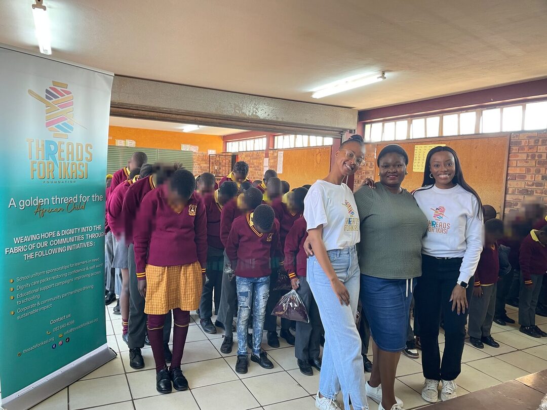 Threads for iKasi Foundation representatives alongside the line of Thuthuka Primary School learners waiting to collect their jerseys, 30 July 2026